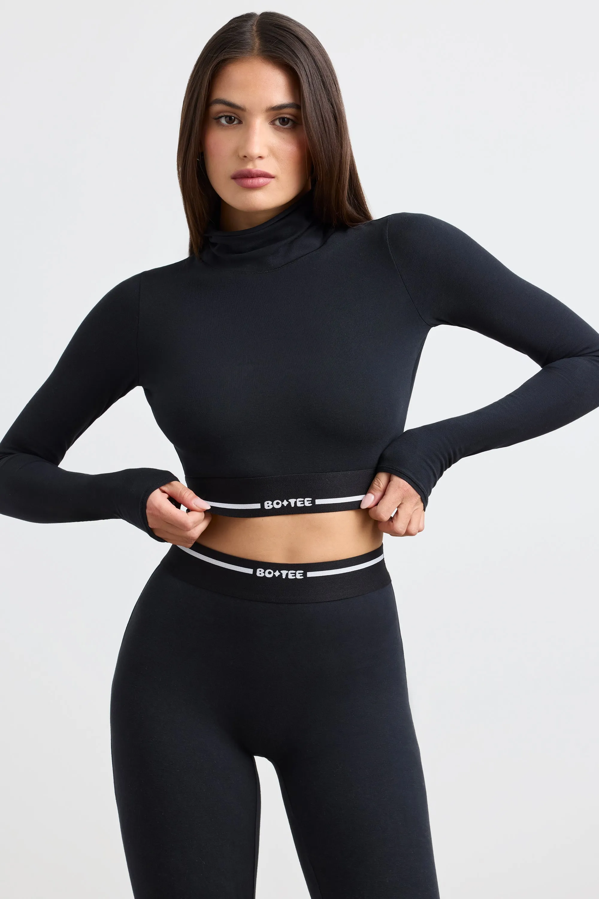 Grounded - Turtleneck Backless Long-Sleeve Crop Top in Black