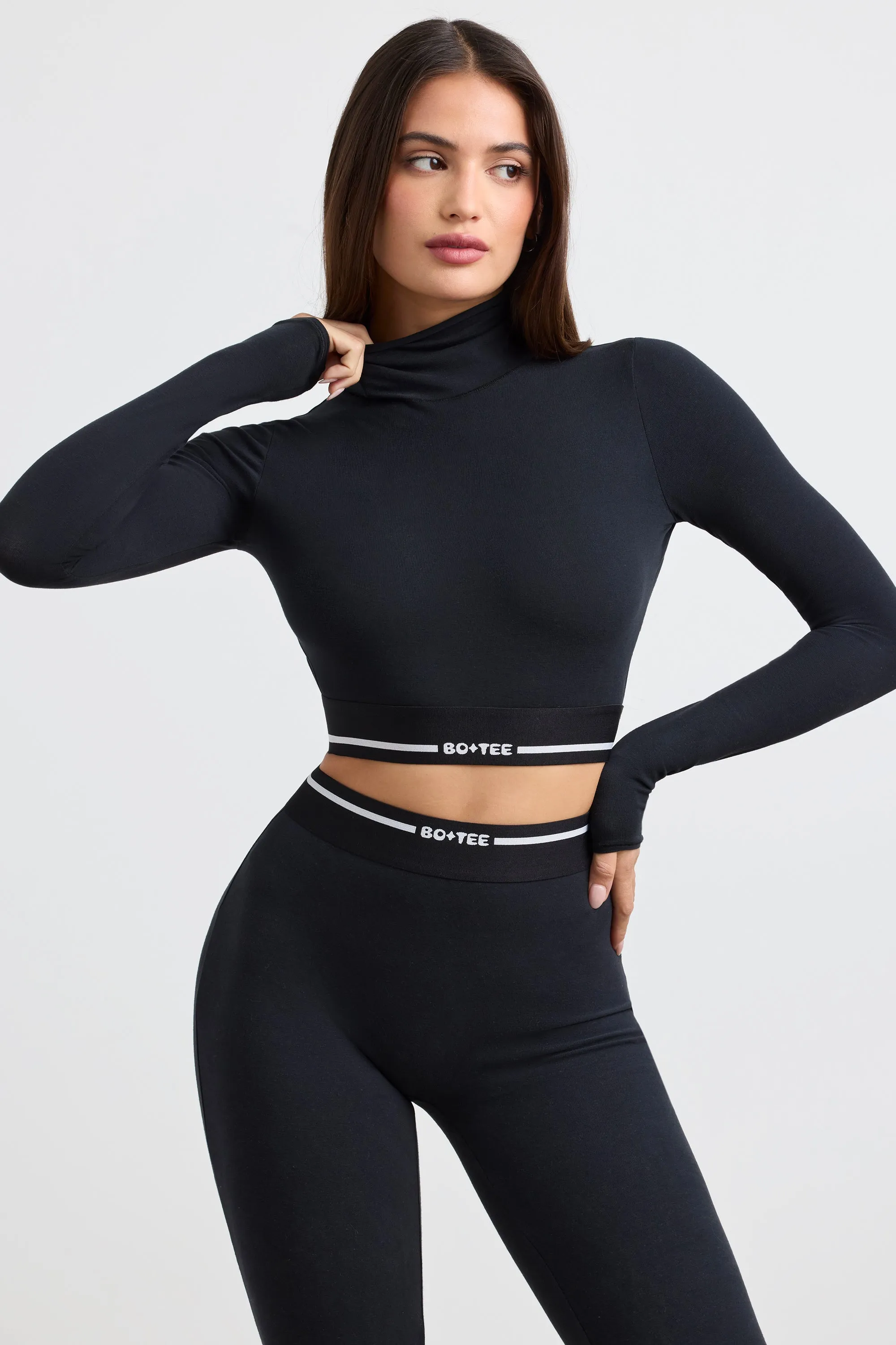 Grounded - Turtleneck Backless Long-Sleeve Crop Top in Black